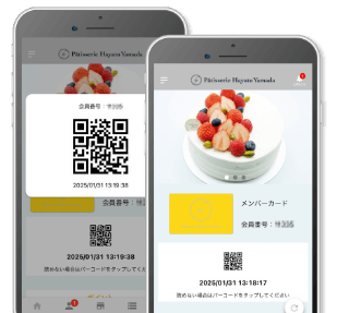 アプリのQRコードが表示されているスマホ1台とアプリのホーム画面の表示されているスマホ1台